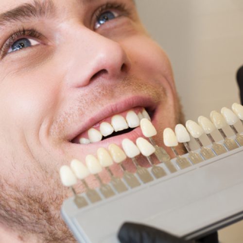 Close,Up,Portrait,Of,Young,Man,In,Dentist,Chair,,Check